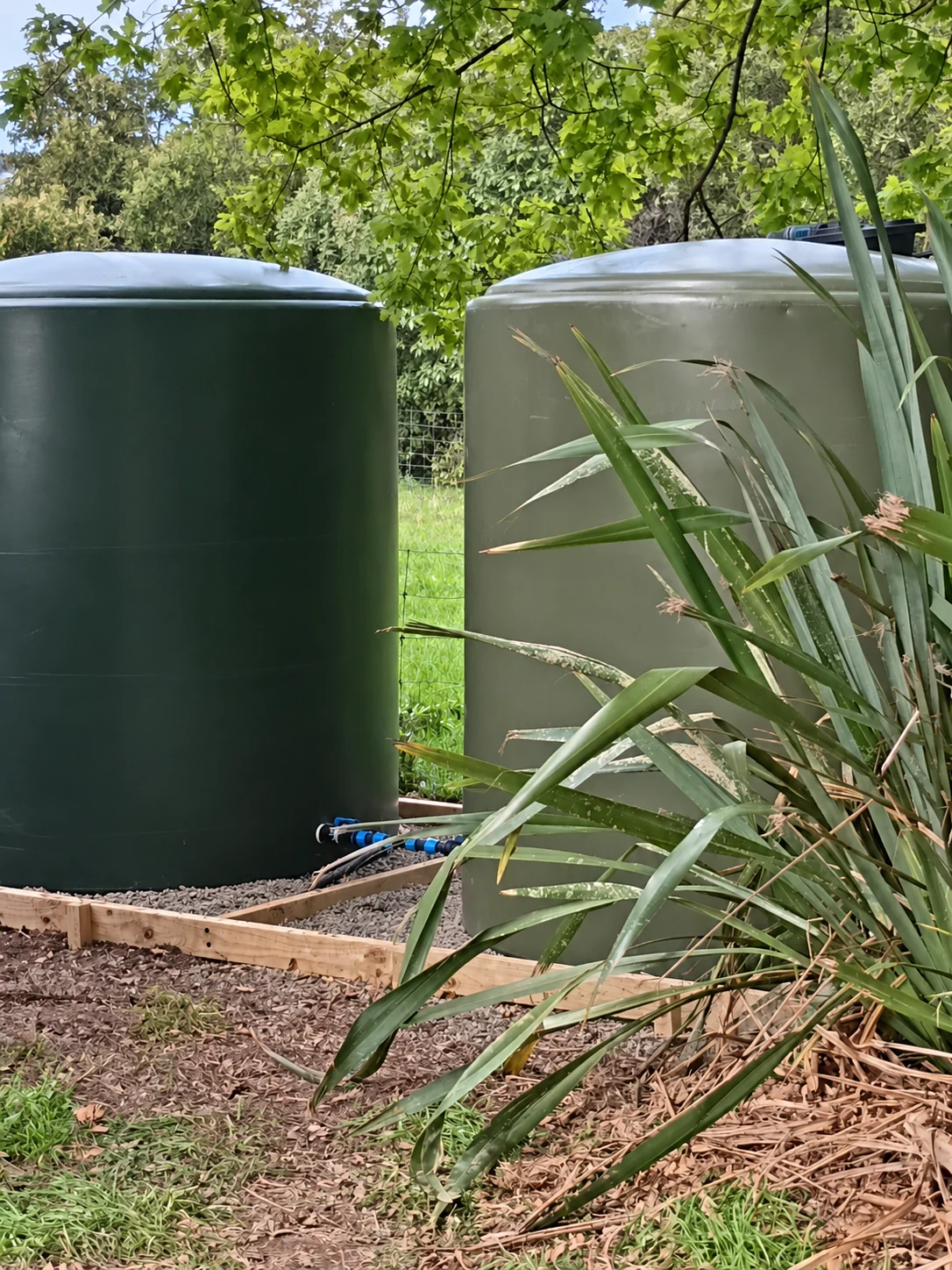 Two tanks on a timber-edged gravel base