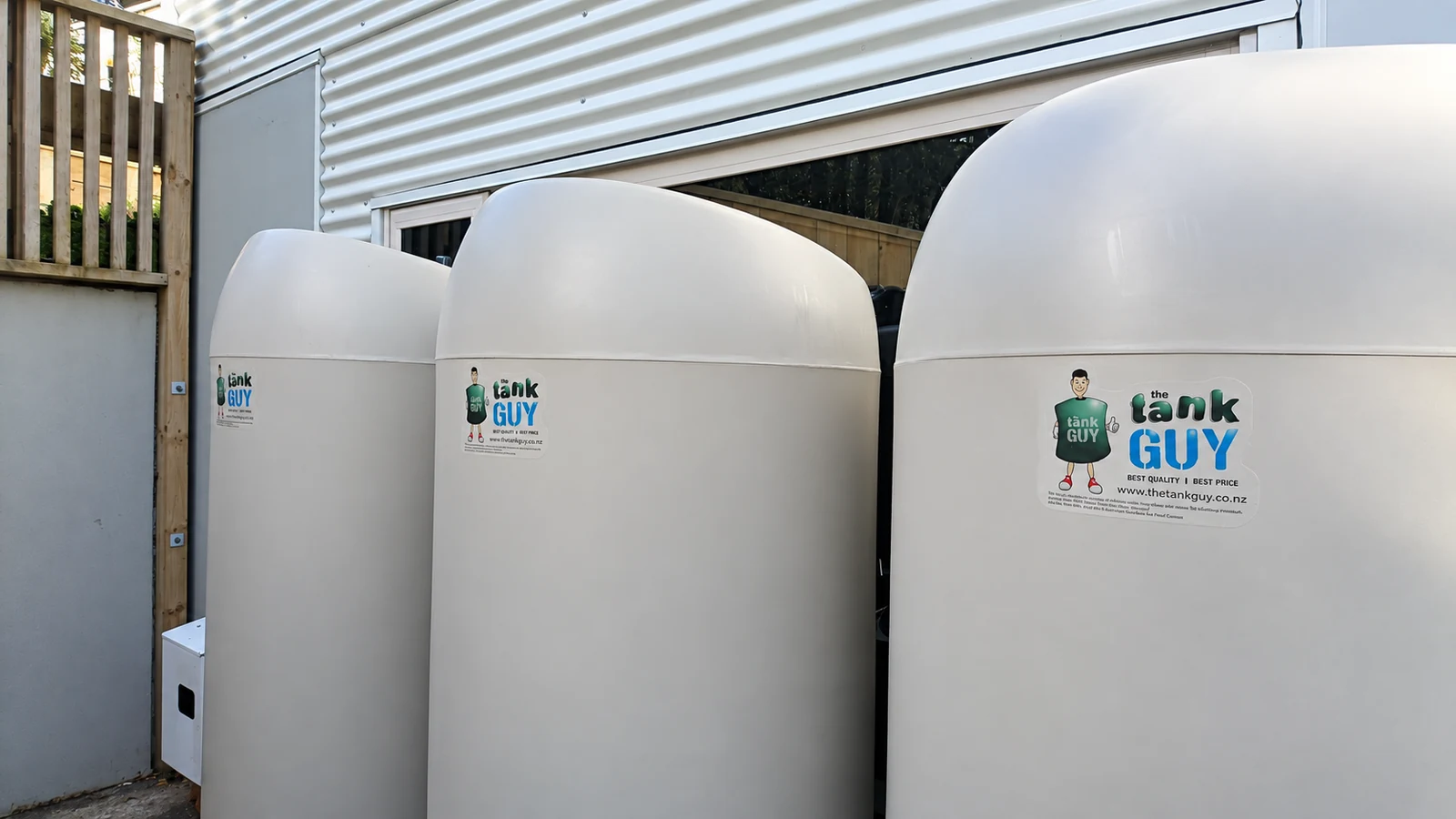 Birch grey slimline tanks beside a home